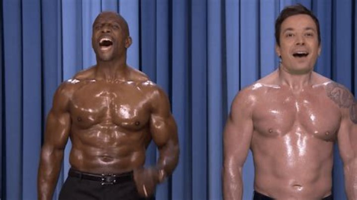 WATCH NOWShirtless Jimmy Fallon Flaunts “Six-Pack” While Taking Part in First-Ever Nip-Sync With Terry Crews